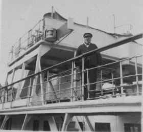 Captain Sharp on the liner tender